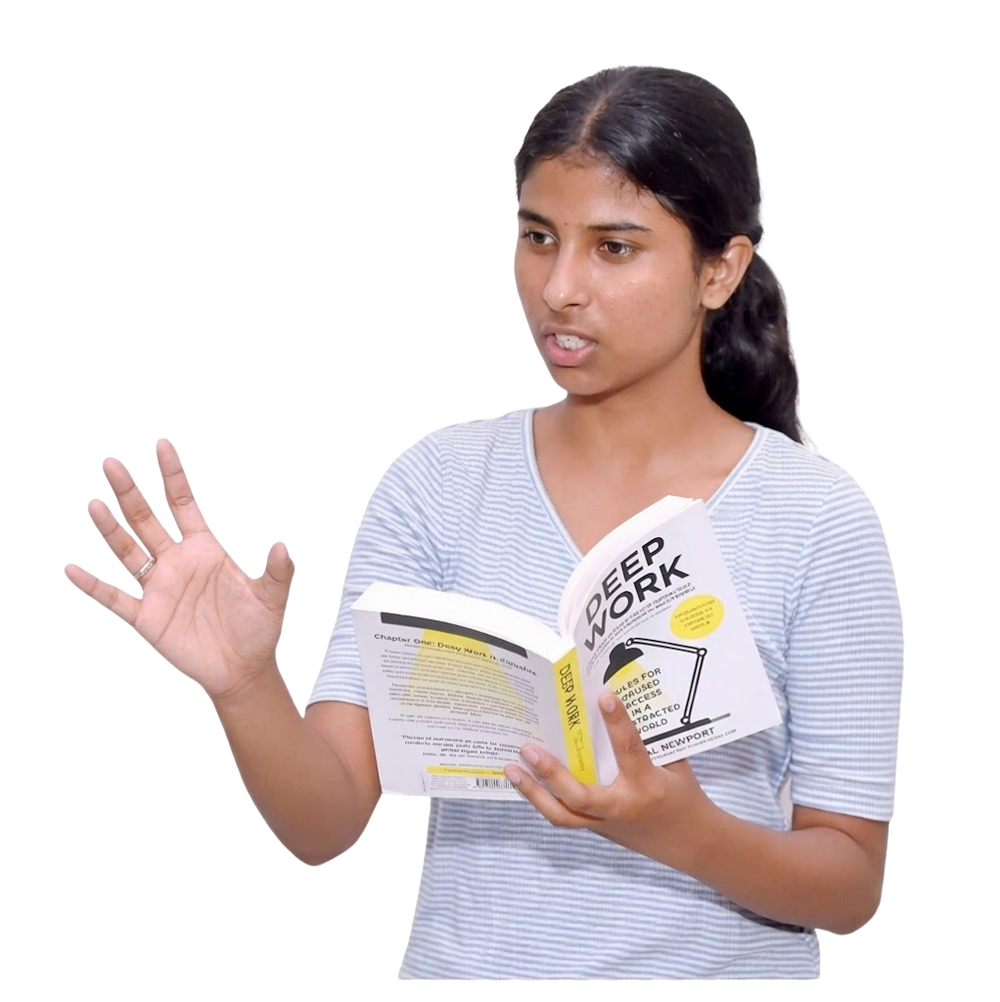 Janhavi Panwar speaking while holding a book